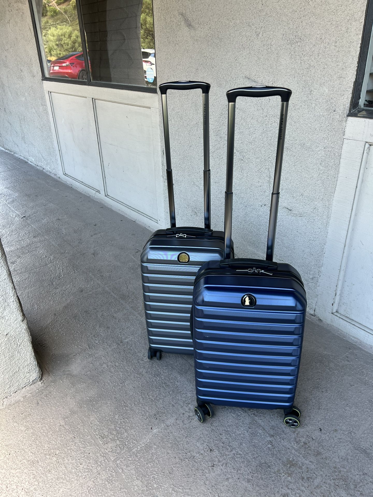 Delsey Hardcase Carry-on Spinner Luggage, Gray or Dark Blue, Like New, $45 each