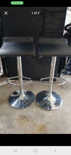 Black/Chrome Adjustable Swivel barstool set. Price negotiable!
