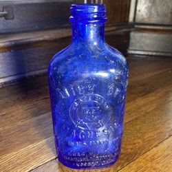 Vintage cobalt blue milk of magnesia bottle