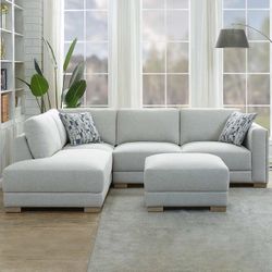 New Drayden Fabric Sectional with Ottoman  Retails for over $1,400  Features: Pocket Coil Seat Cushion Sinuous Spring Seat Support Solid Wood Legs Inc