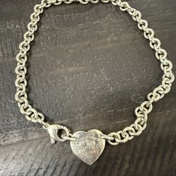 Tiffany & Co. Return to Tiffany Sterling, silver heart charm necklace.