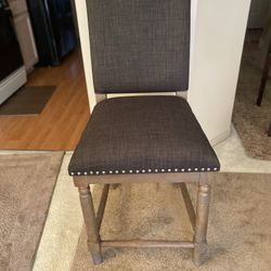 *BAR STOOL BRAND NEW * WOOD AND GREY UPHOLSTERED BAR STOOL WITH NAILHEAD TRIM. SHARP!
