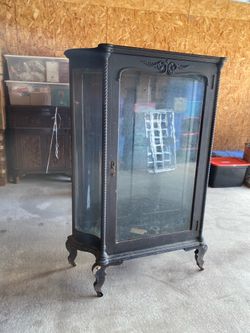 Antique cherry cabinet with shelves.