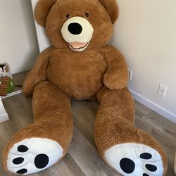 Giant teddy bear, brown cuddle sofa, bear
