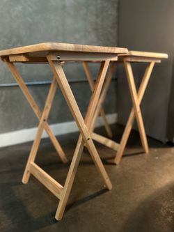 Two foldable tray tables