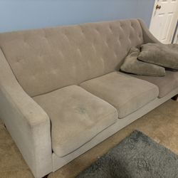 Cream tufted couch