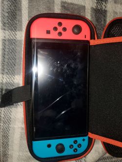 Nintendo Switch with games and 4 controllers.
