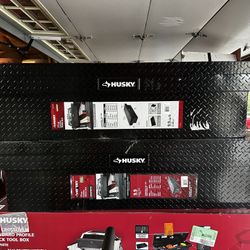 Bright aluminum truck tool box has diamond plate texture and crossover style. Available in black. This Husky brand storage unit is 71.3 inches wide wi