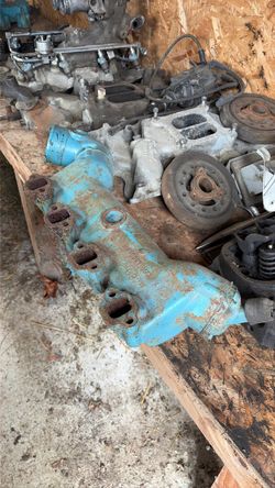 1975 OMC 908997 marine exhaust manifold with OMC Exhaust Elbow 880617