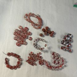 Mixed lot of 8 styles of beads -reddish orange and clear/frosted tones qty 135