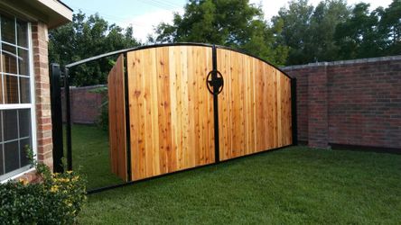 Nice swing Gate with arch design and cedar wood.