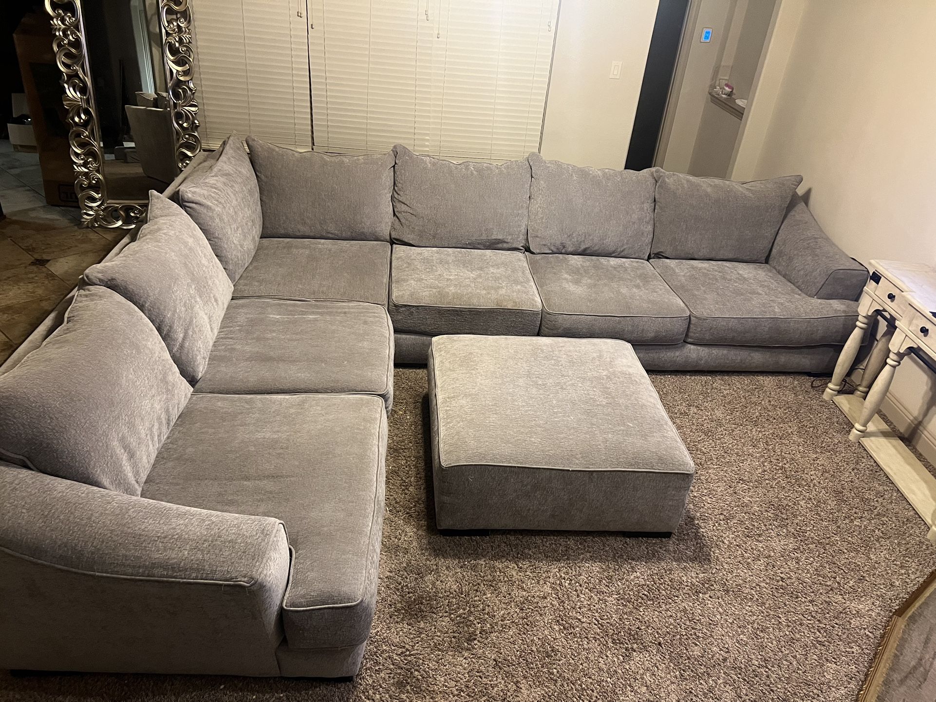 Large gray sectional sofa with ottoman