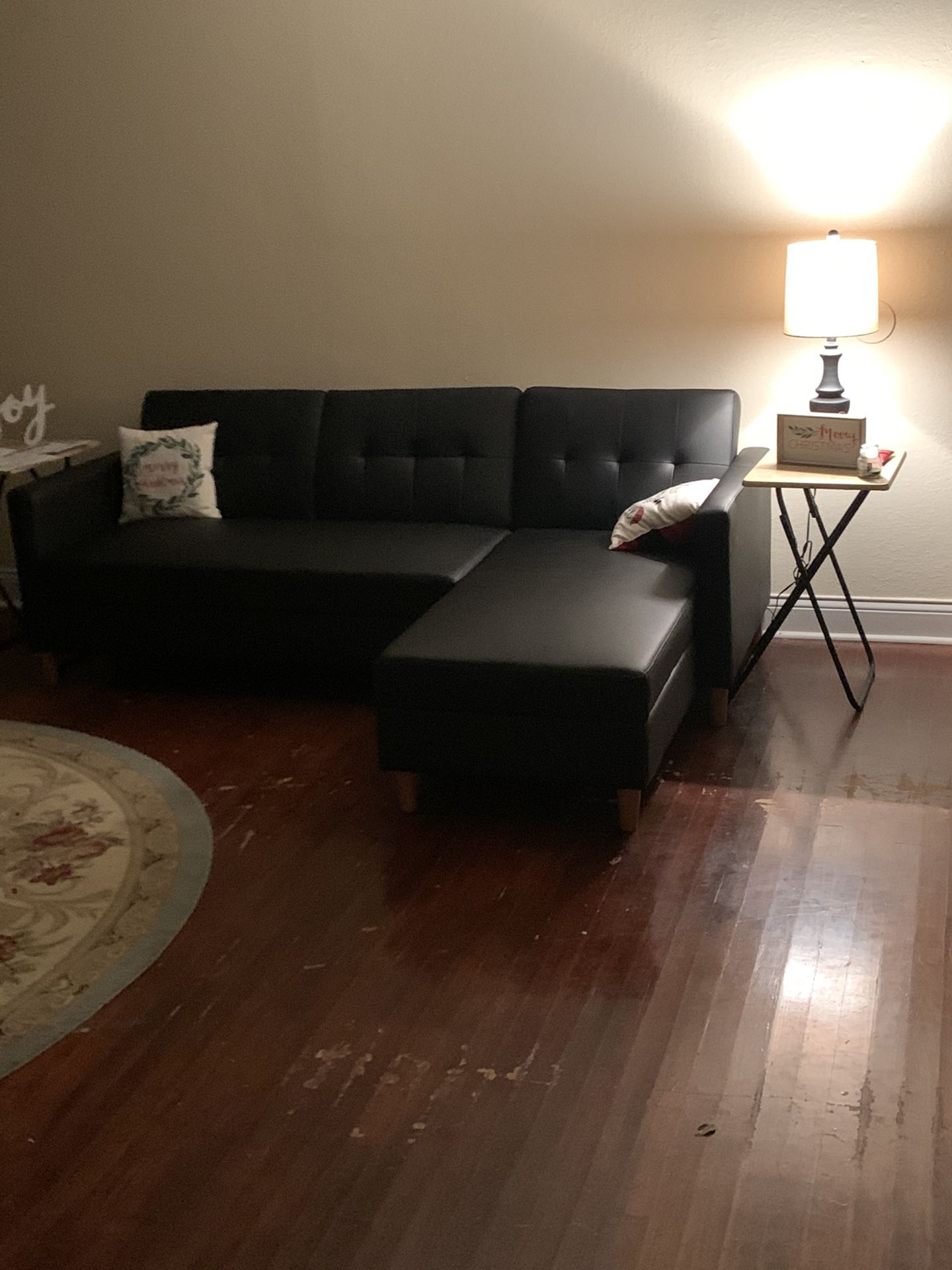black small sectional (turns into bed)