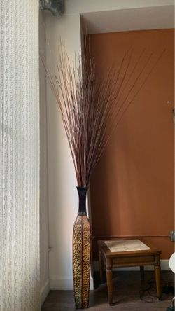 Decorative vase with branches.