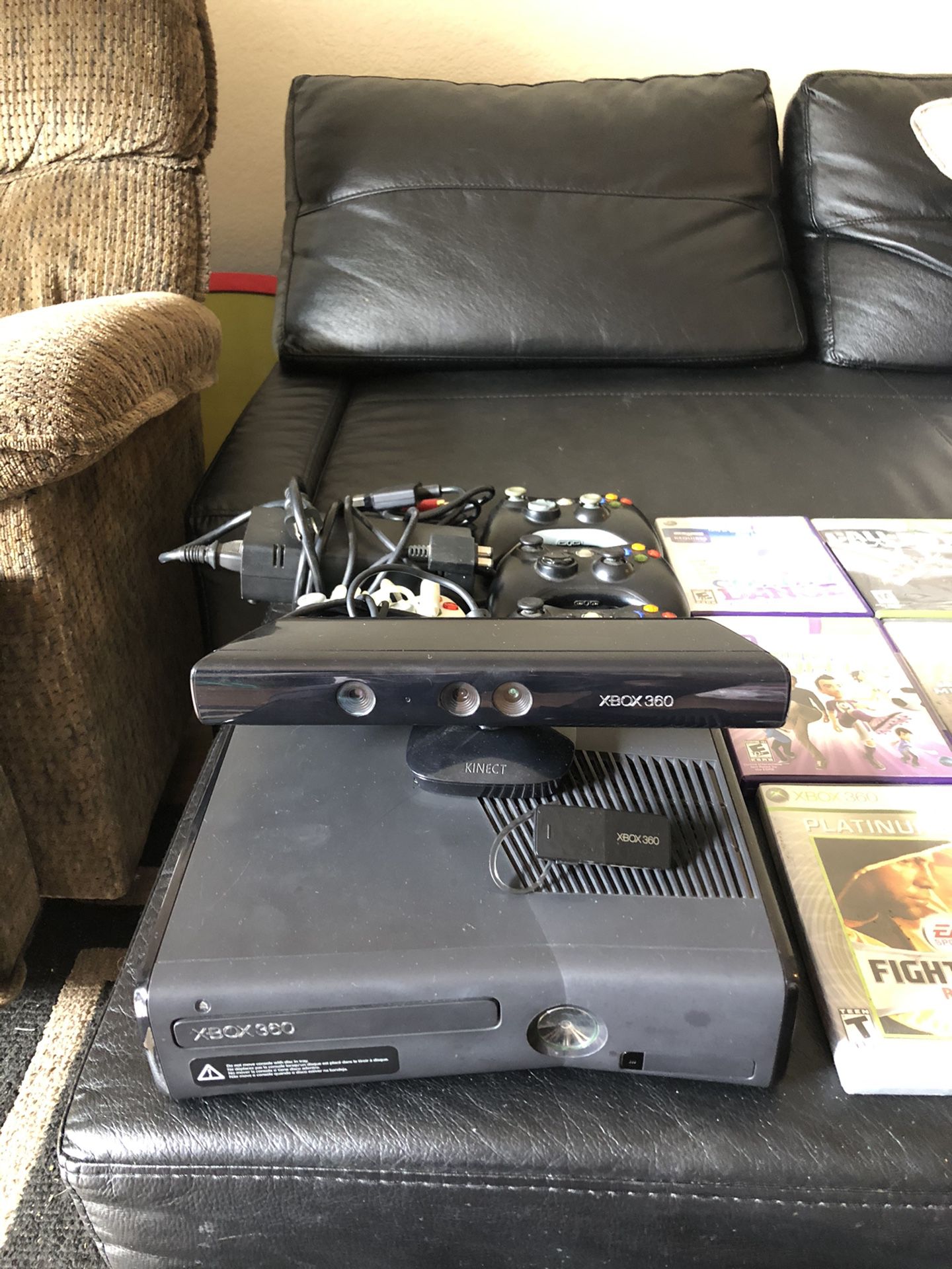 Xbox 360 with Kinect and 20 games and 4 controllers and a ear piece