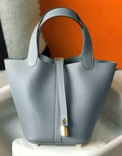 Genuine Leather Bucket bag with lock and drawstring insert
