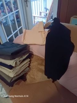 Mixed Lot of Folded Pants and Clothing
