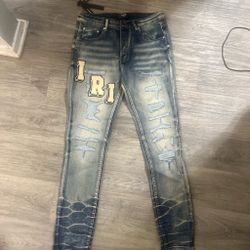 Amiri Distressed Slim Jeans with Varsity Patches