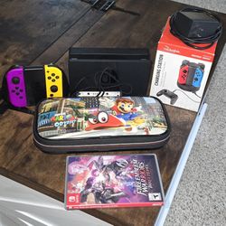 Nintendo Switch + 4 Joycon Controllers w/ 4 Controller Charging Station + Case + 2 Paid Games 
