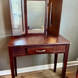 Vintage small, solid wood vanity table with a tri-fold mirror