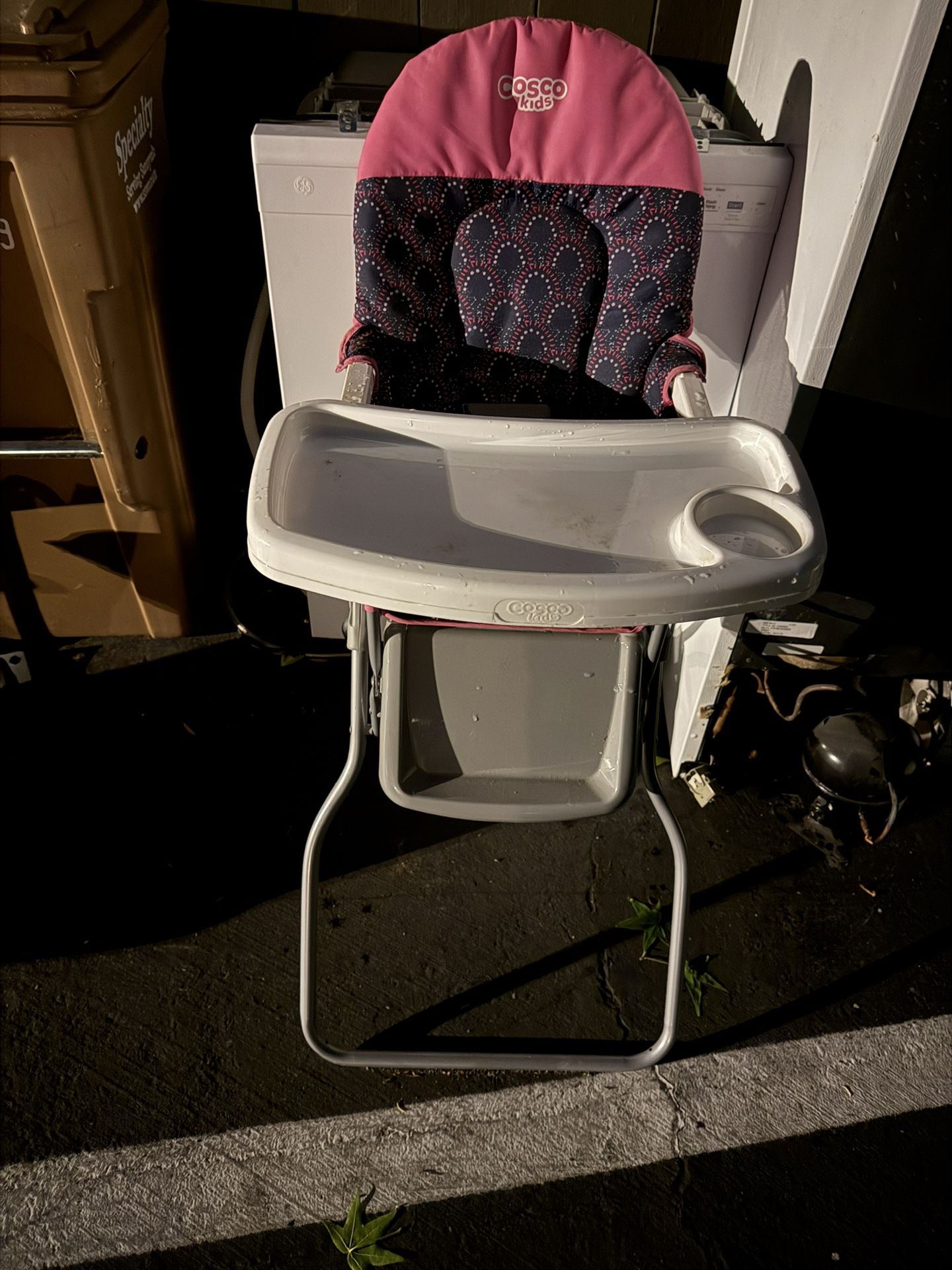 Small Cosco Kids high chair with meal tray.