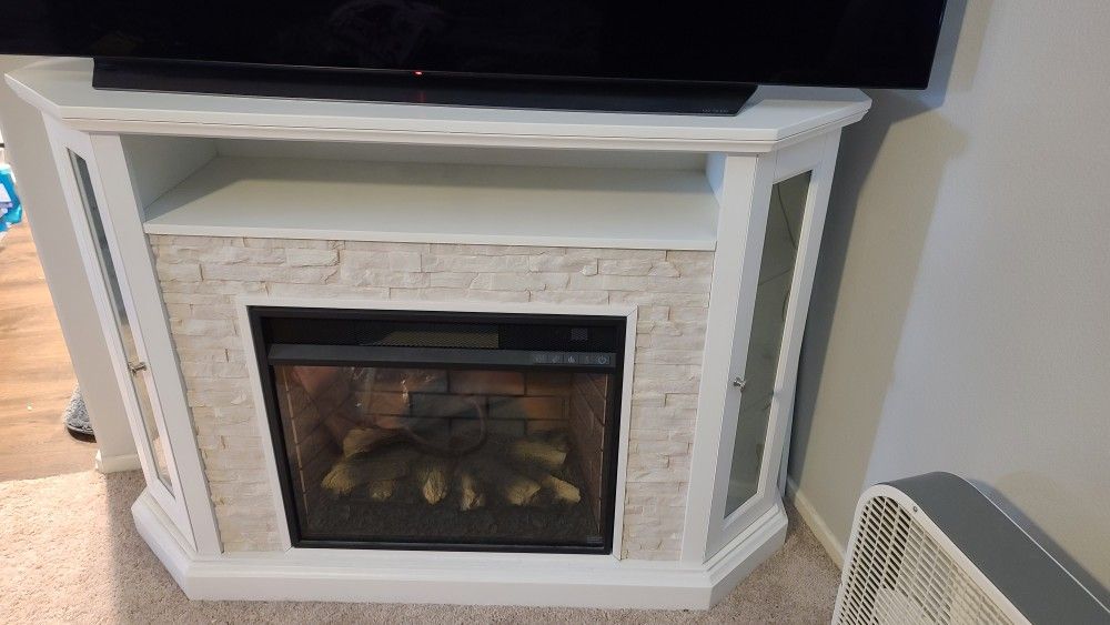 Vanegas Corner TV Stand for TVs up to 55" with Fireplace Included