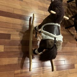 Toddler size rocking horse with realistic horse noises. New AA batteries. 22" tall, 30" long, 13" wide. Both ears have buttons to start horse noises..