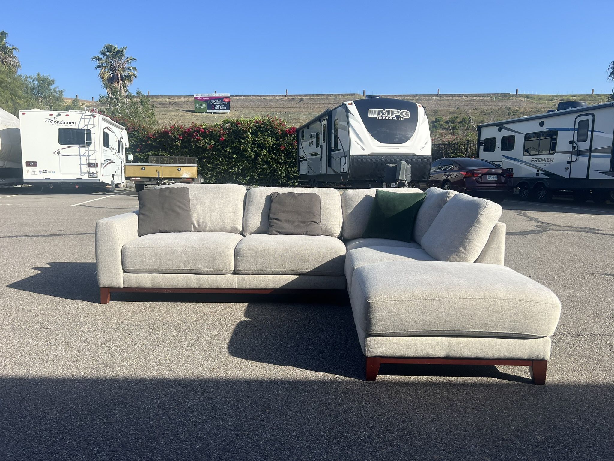 Gray Living Spaces sectional sofa couch with right facing chaise
