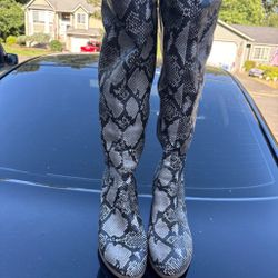 Snake print knee high boots