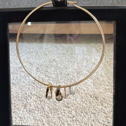 A Choker Necklace With Four Cubic Zirconia Diamonds