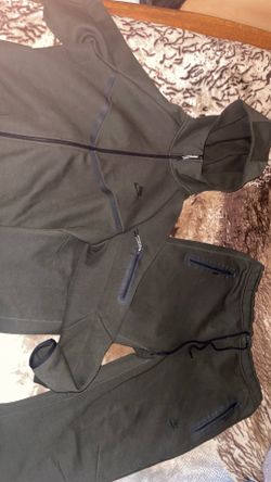 Green Nike tech suit 