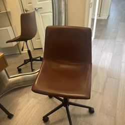 Desk Chair Brown Faux Leather in very good shape.  Its height is Adjustable.  Very sturdy. Hardly used. 