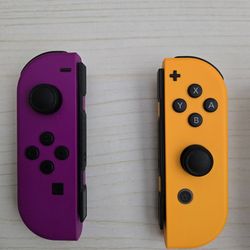 Nintendo Switch official joy cons orange and purple