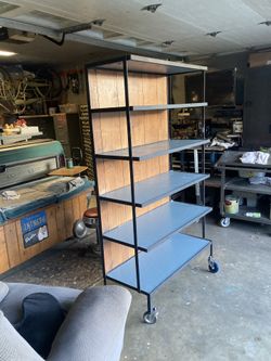 Shelving unit on wheels.