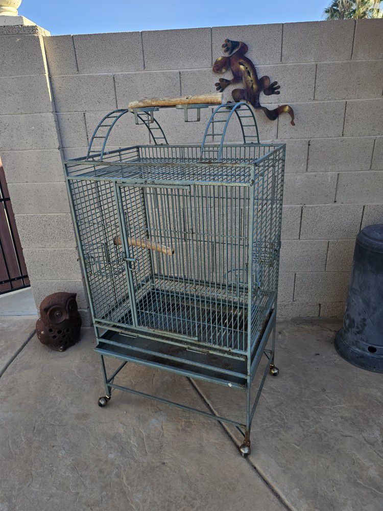 Large Bird Cage Has 4 Openings On Wheel 