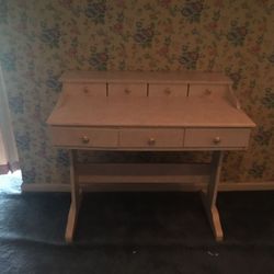 Pink desk with floral knobs