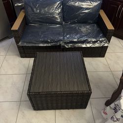 NEW WAYFAIR OUTDOOR LOVESEAT AND TABLE (BROWN RATTAN)/Navy Blue Pillows