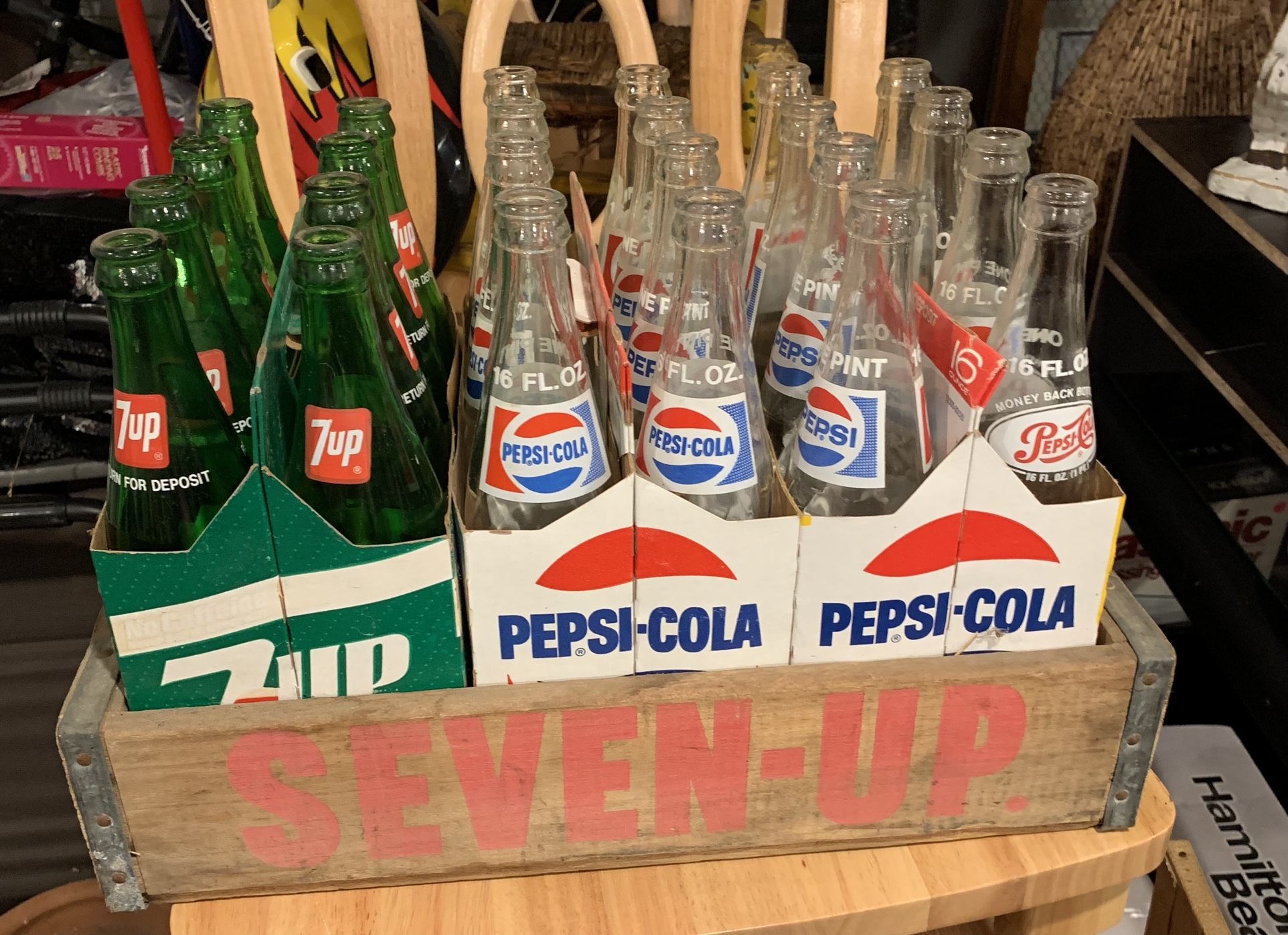 Retro case of 16 oz. 7-up and Pepsi bottles in cases includes crate