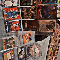 Baseball cards and a baseball autographs game use memorabilia, bats, jerseys, rookies, and stars