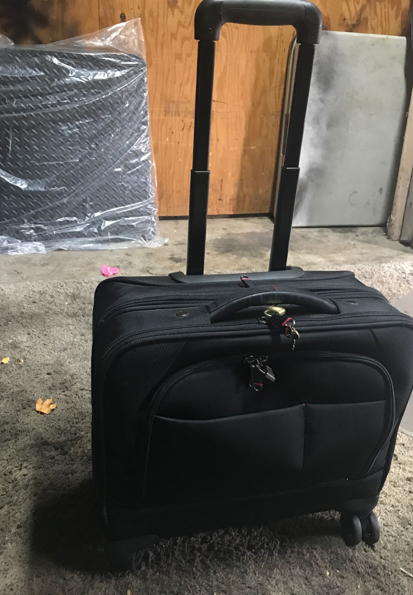 Rolling briefcase with locks and keys