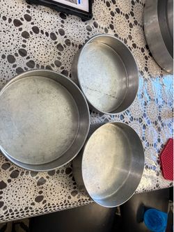 Practical set of three round aluminum 10” cake pans. $8 each