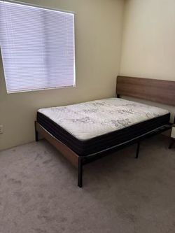 Full size bed with spring mattress
