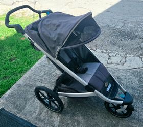 Thule Single Baby Stroller. One seater.  Light Blue/ Black.  Runs Great. Need Some Cleaning. Folds perfect.