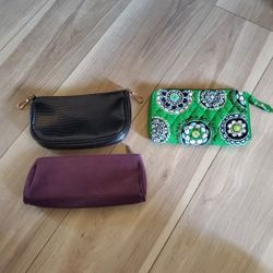 and makeup case set by Vera Bradley and Estee Lauder and a no name brand.