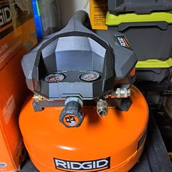 RIDGID6 Gal.​ 150 PSI Portable Electric Oil-​Free Jobsite Pancake Air Compressor with Dual Pressure Gauges and 2-​Quick Couplers