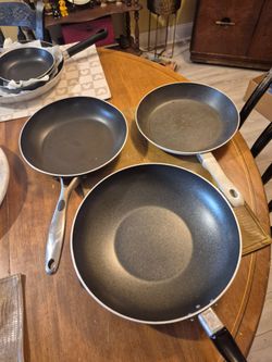 Two T-Fal 12" and 10 " Fry pans and one tramontina 10" pan
