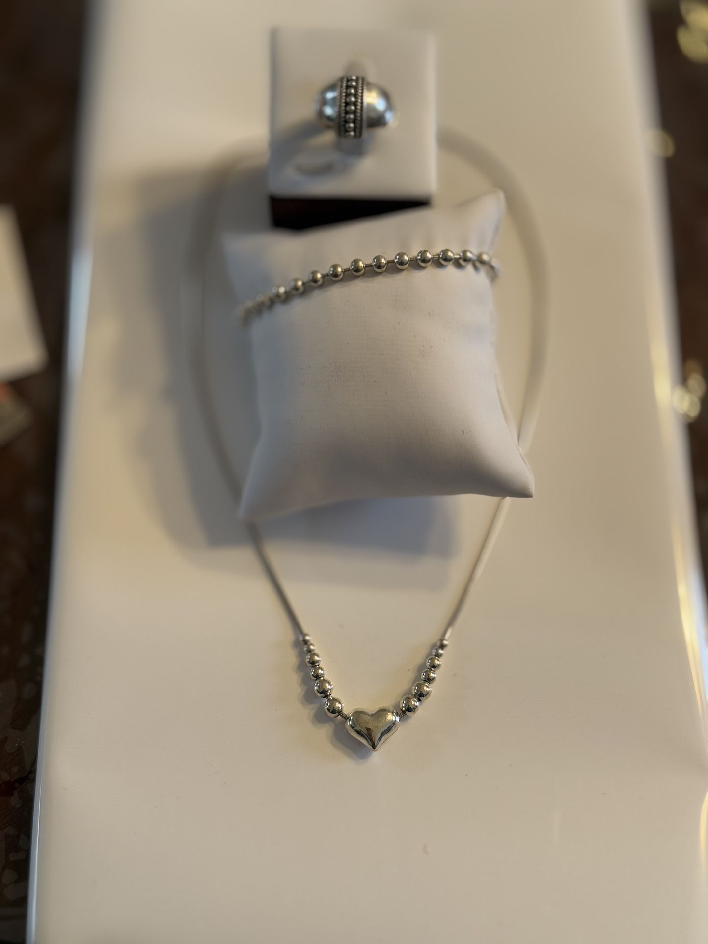  set of sterling silver jewelry, including a beaded necklace with a heart pendant, a beaded bracelet, and a ring with a beaded design Ring size  7” Ne