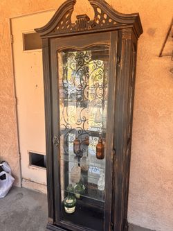 Gothic Victorian style cabinet with shelves and light