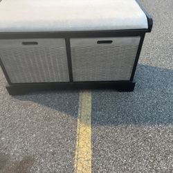 Wooden Bench With Two Wooden Baskets , And A Cushion on top .  32 1/2” wide  15” Deep  19” tall  