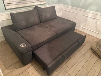 Gray Fabric Loveseat with Cup Holders and Pull-Out Bed